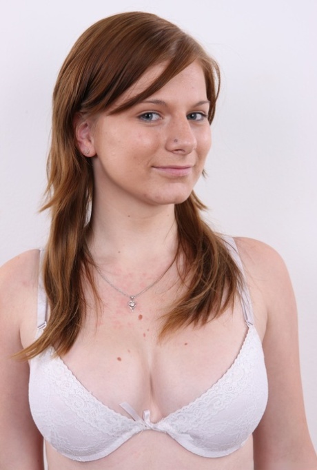 Redhead amateur Sabrina stands naked with hands on hips during a solo gig 35569596