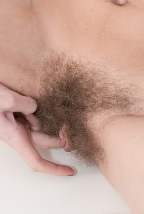 Hairy amateur babe Lillian Vi stripping & rubbing her big clitoris 98677194