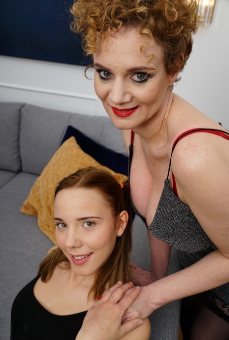 Old and young lesbians 69 while having sex on a bed in their heels 61490942