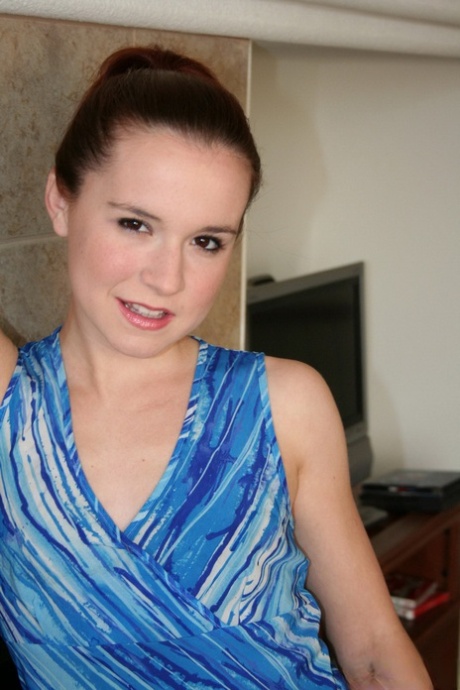 Pale redhead Annabelle Lee strips off her clothes in front of a cold fireplace 20564269