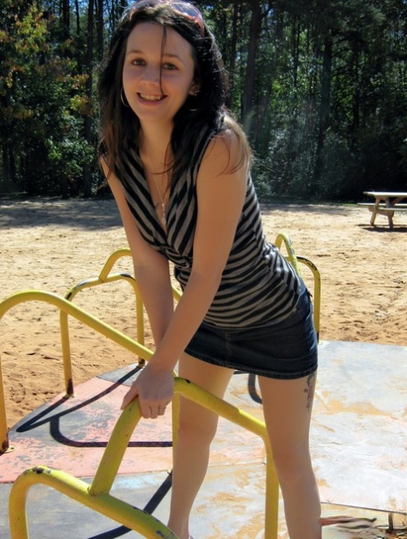 Dark haired girl flashes her tits and ass at a public playground 55240447