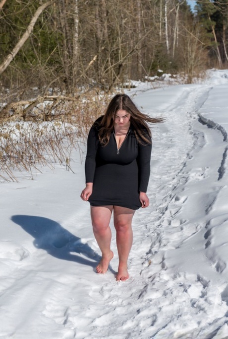 BBW solo girl is ball gagged and bound on snow-covered ground in the nude 51410777