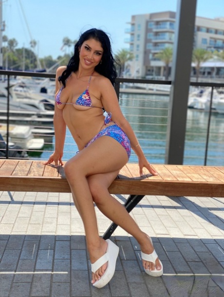Brunette teen Queenie Sateen models a bikini at a marina before POV oral sex 13077613