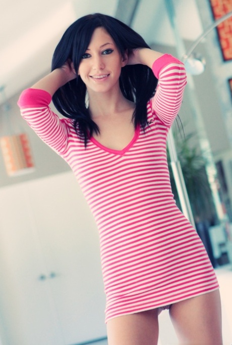 Dark-haired beauty Catie Minx works partially free of a short dress 28586588