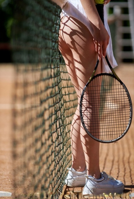 Pretty brunette teen Elena Max flashes her pussy while playing tennis 68386271