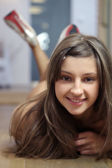 Young skinny Maria takes a dare to pose naked in the school hallway in heels 31122063