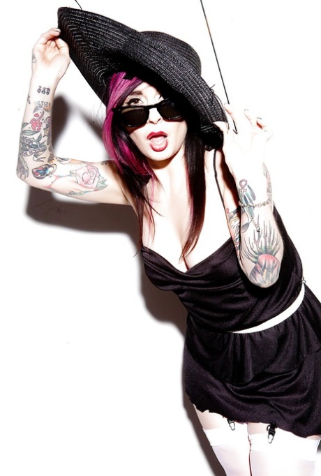 Glamorous tattooed brunette slowly uncovering her seductive curves 54922077