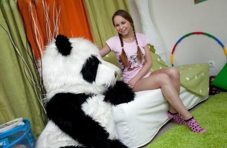 Seductive teen babe with pigtails having fun with her big panda toy 73244619