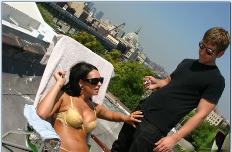 Lusty teen Kitty Bella gets a thick dick to suck on the roof 34683175