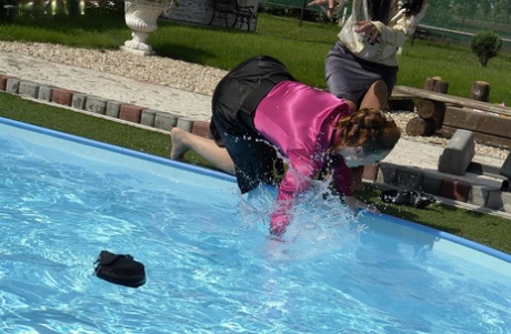 Playful fetish ladies have some wet fully clothed pool fun 26961596